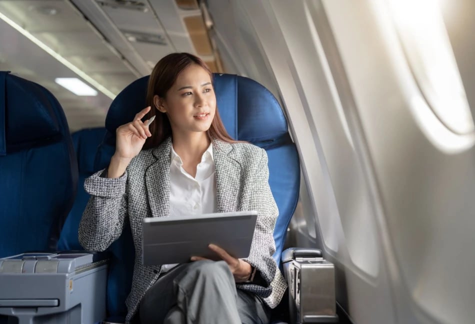 Woman on plane looking out
